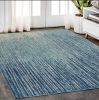 5' X 7' Ivory And Blue Abstract Stripes Power Loom Area Rug