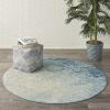 5' Ivory And Blue Round Abstract Power Loom Area Rug