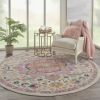8' Pink And Ivory Round Southwestern Dhurrie Area Rug